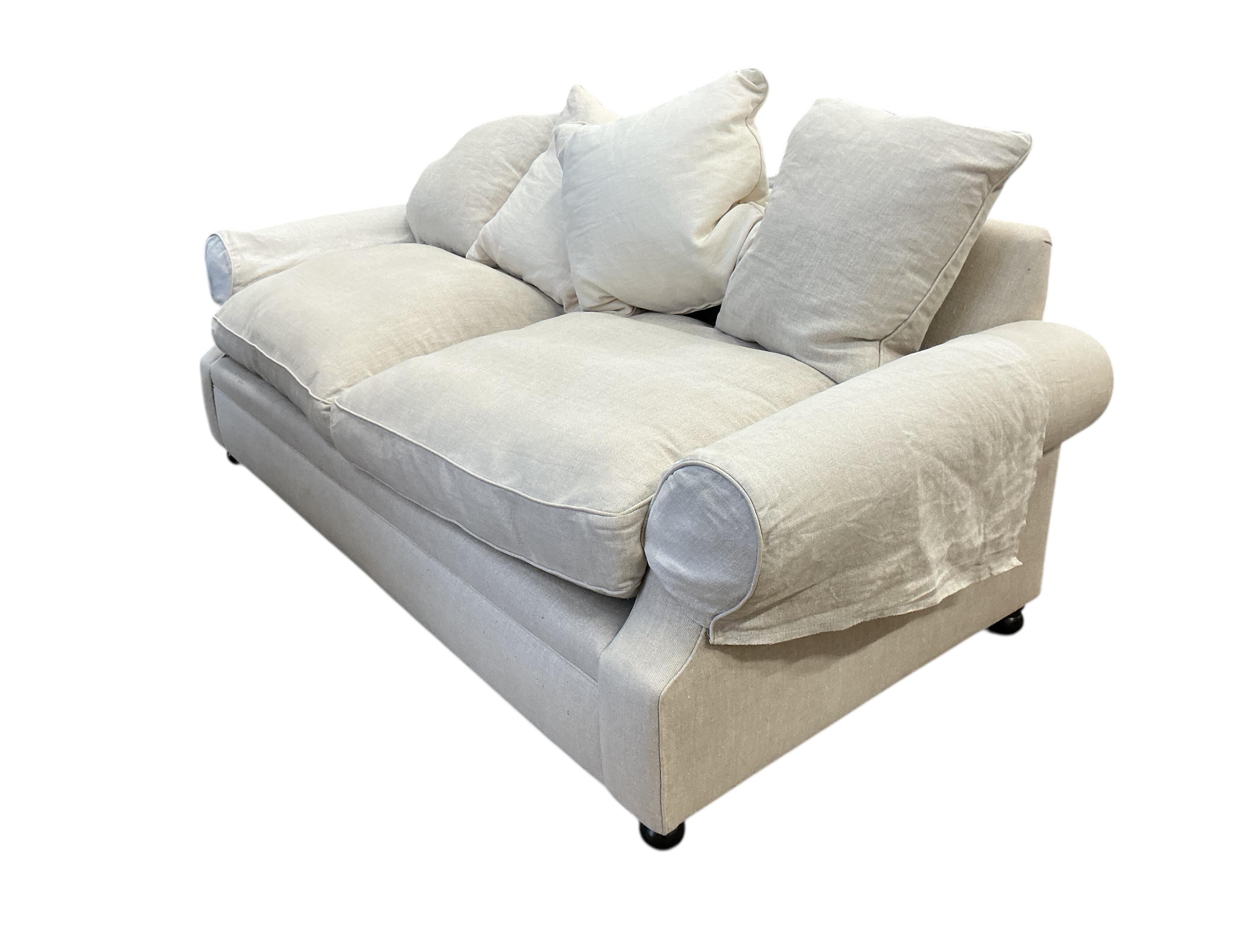 A Contemporary three seater sofa upholstered in natural fabric, width 220cm, depth 100cm, height 90cm